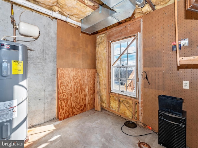 interior space featuring water heater and unfinished concrete floors