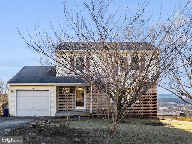 view of front of property with aphalt driveway, brick siding, an attached garage, and roof with shingles