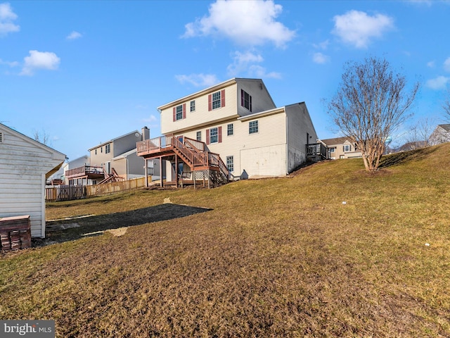 rear view of property featuring a yard, stairway, fence, a residential view, and a wooden deck