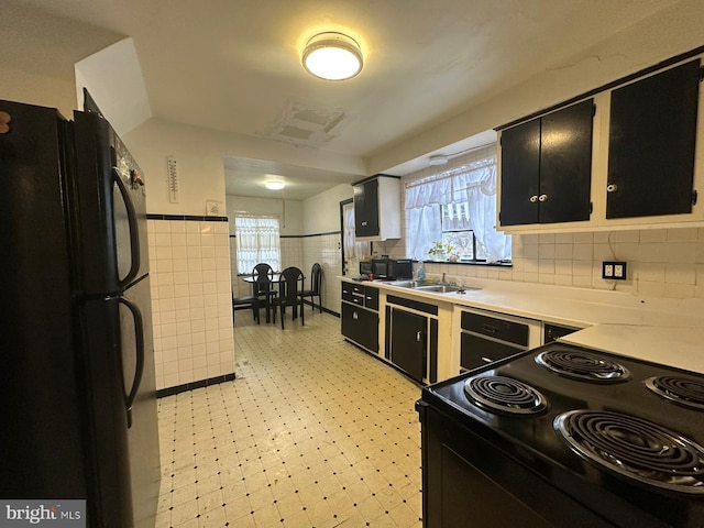 kitchen with sink and black appliances