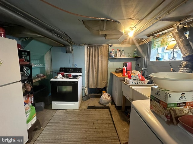 kitchen featuring white fridge and electric range oven