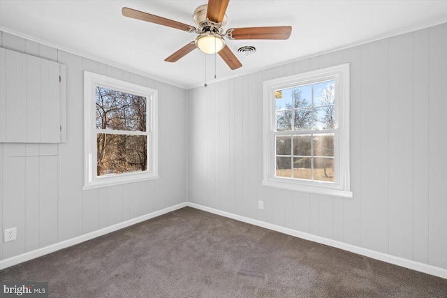 carpeted empty room featuring crown molding and ceiling fan