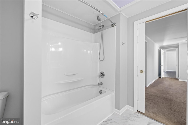 bathroom with shower / bath combination and toilet