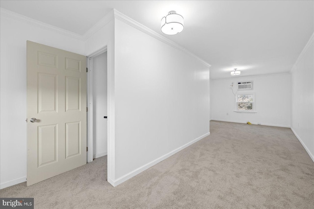 interior space featuring a wall mounted air conditioner, ornamental molding, and light carpet