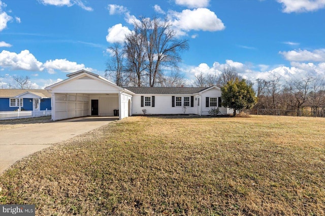 ranch-style house featuring a carport and a front yard