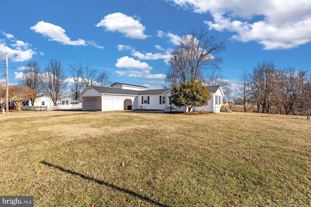 exterior space with a garage and a front yard