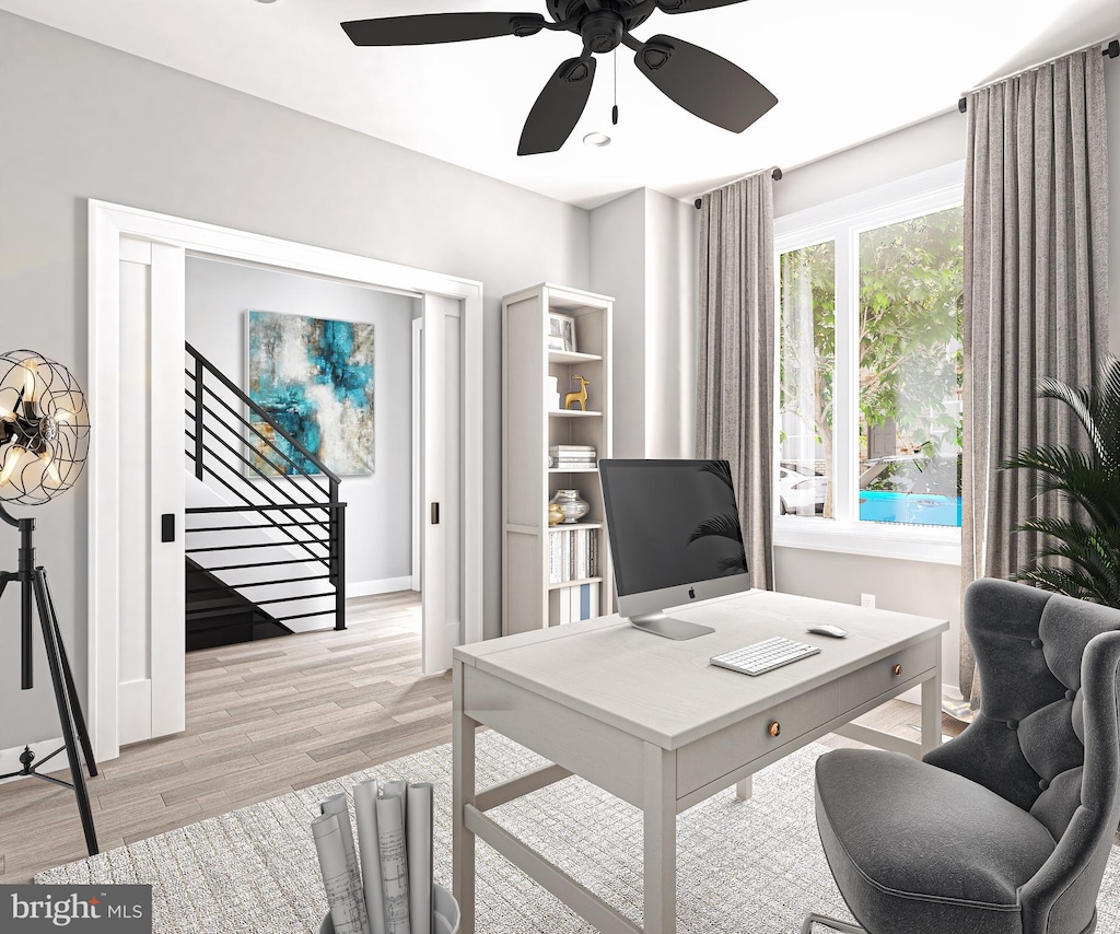 office area with ceiling fan and light wood-type flooring