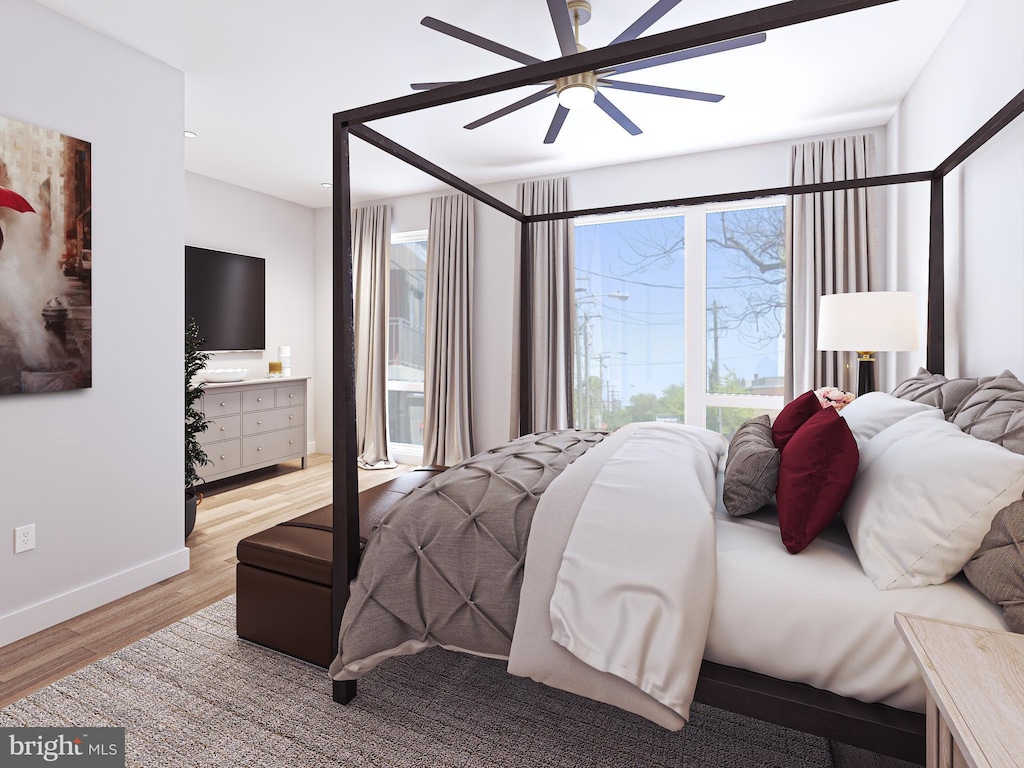 bedroom featuring ceiling fan and light hardwood / wood-style flooring