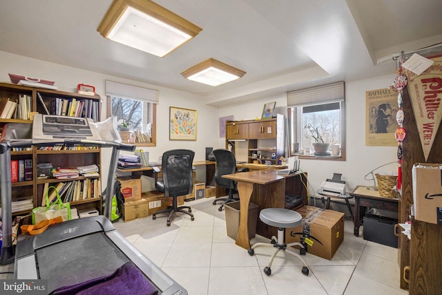 office featuring a healthy amount of sunlight and light tile patterned flooring