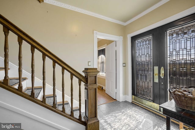 entryway with french doors, visible vents, stairway, ornamental molding, and baseboards