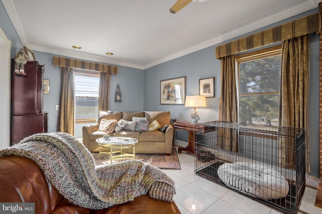 living area featuring ornamental molding and light tile patterned floors