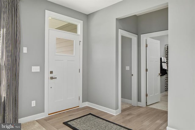 foyer entrance with light hardwood / wood-style flooring