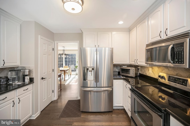 kitchen with white cabinetry, dark hardwood / wood-style flooring, and stainless steel appliances