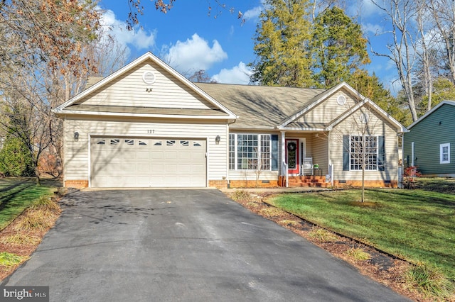 ranch-style home with a garage and a front lawn