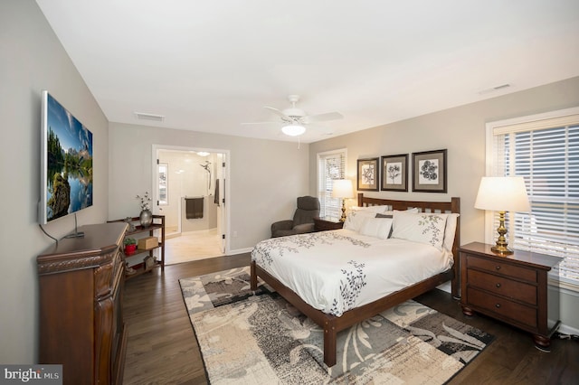 bedroom featuring ceiling fan and dark hardwood / wood-style floors