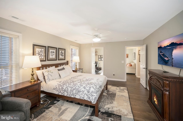 bedroom featuring ceiling fan and dark hardwood / wood-style flooring