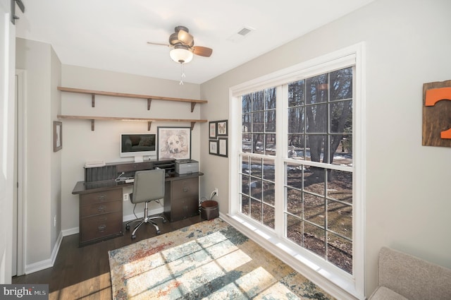 office space with dark hardwood / wood-style floors and ceiling fan