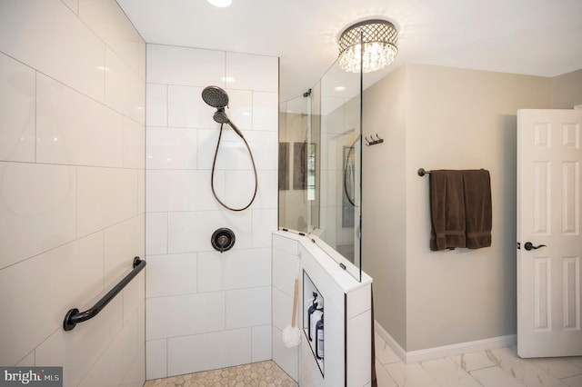 bathroom with a tile shower