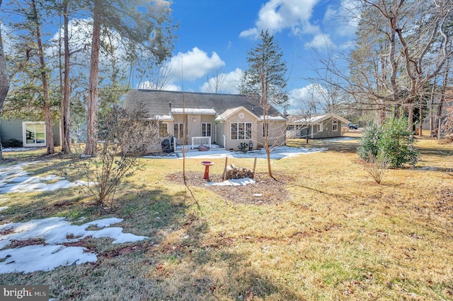 rear view of house with a lawn