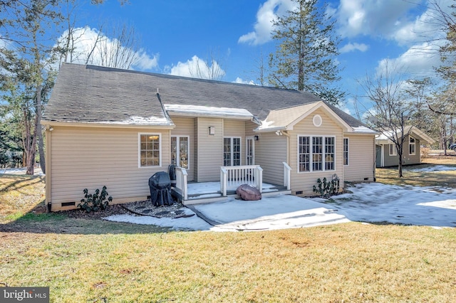 rear view of house featuring a yard and a patio area