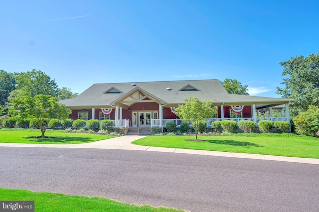 view of front of property featuring a front lawn and french doors