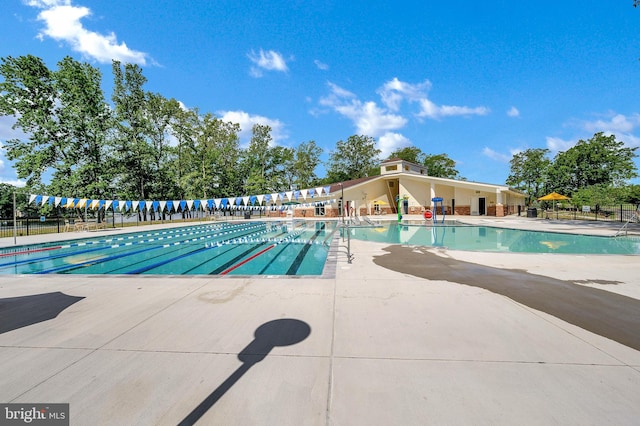 view of pool featuring a patio