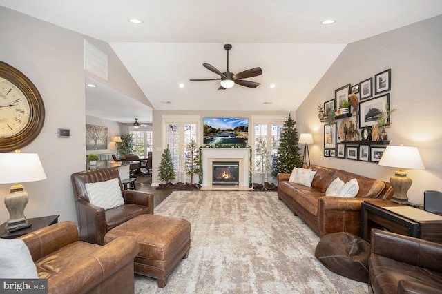 living room featuring lofted ceiling and ceiling fan