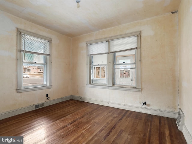 empty room featuring wood-type flooring