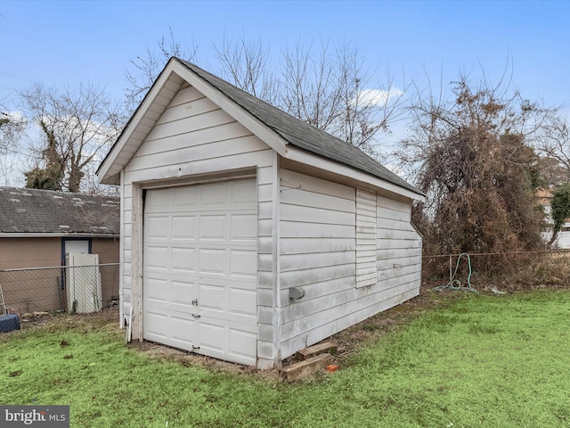 garage featuring a lawn