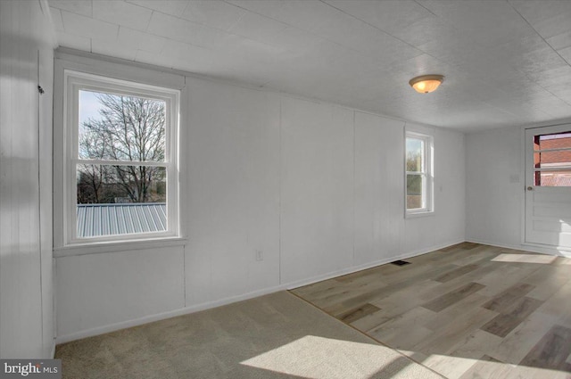 unfurnished room with light hardwood / wood-style floors