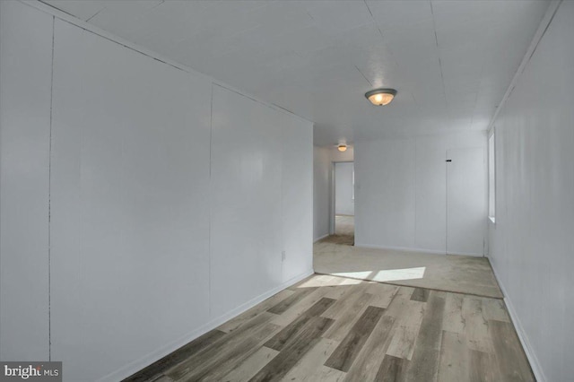 spare room with light hardwood / wood-style floors