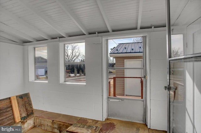 sunroom with beamed ceiling