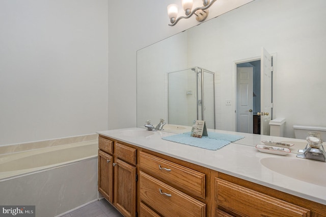 full bathroom with shower with separate bathtub, vanity, toilet, tile patterned floors, and an inviting chandelier