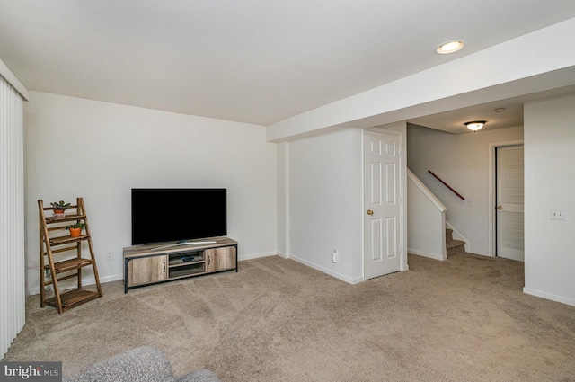 unfurnished living room with light colored carpet