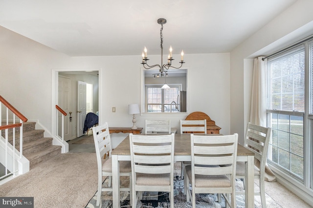 dining area featuring a notable chandelier