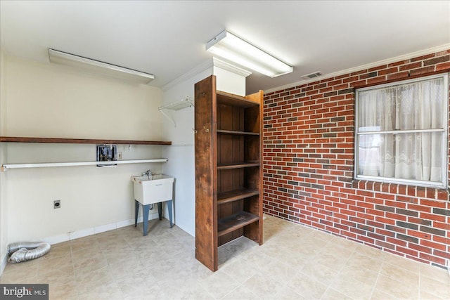 interior space featuring brick wall