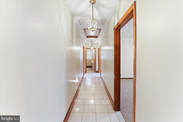 hallway featuring light tile patterned flooring