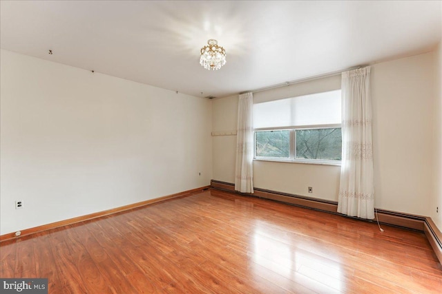 spare room with light hardwood / wood-style flooring