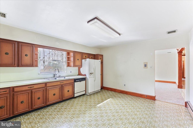 kitchen with white appliances and sink