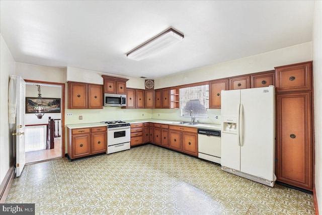 kitchen with sink and white appliances