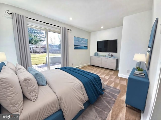 bedroom featuring access to exterior and light wood-type flooring