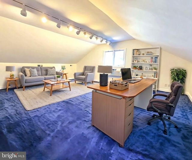 office space featuring dark colored carpet and lofted ceiling