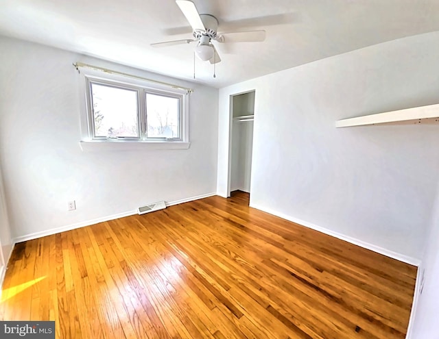 unfurnished bedroom with wood-type flooring and ceiling fan