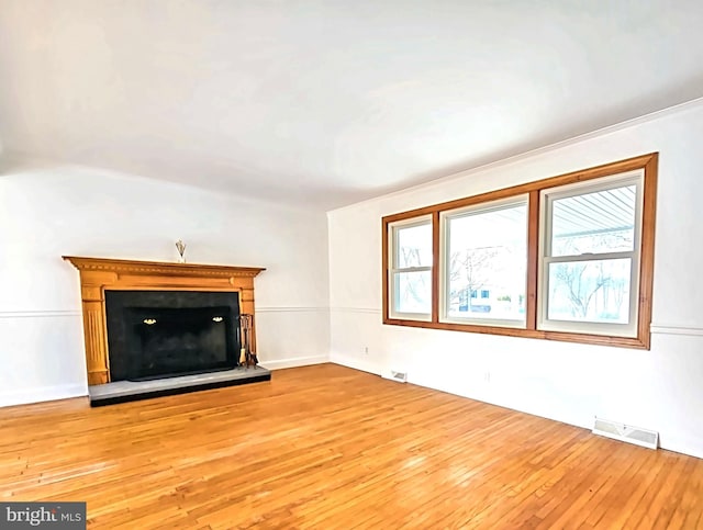 unfurnished living room featuring light hardwood / wood-style floors