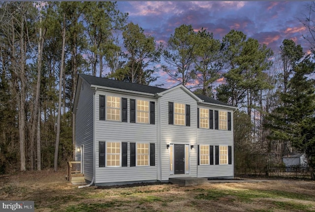 view of front of home with a yard