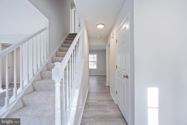 stairs with wood-type flooring