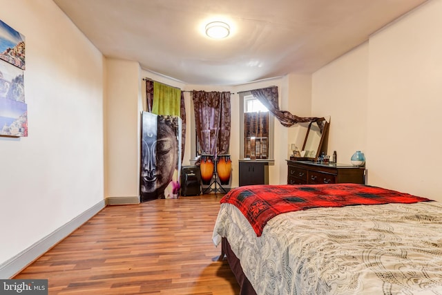 bedroom featuring hardwood / wood-style floors