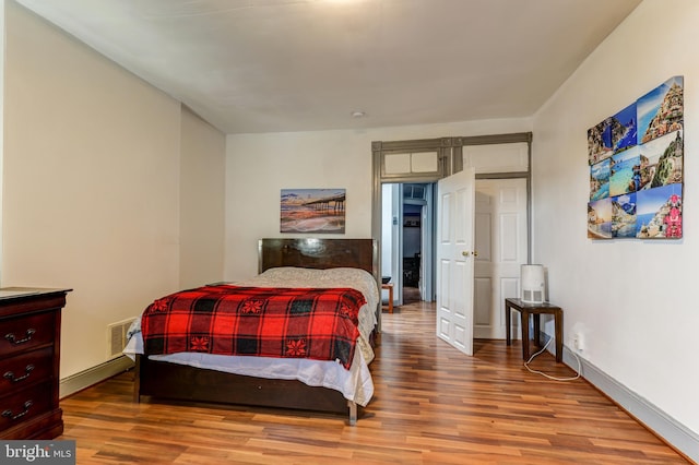 bedroom featuring wood-type flooring