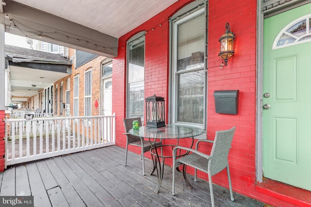 wooden terrace with a porch