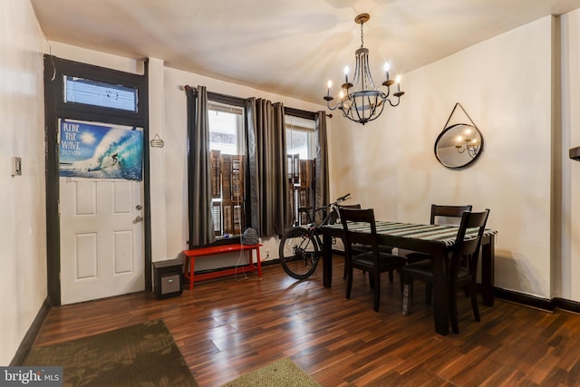 dining room with a chandelier and dark hardwood / wood-style flooring